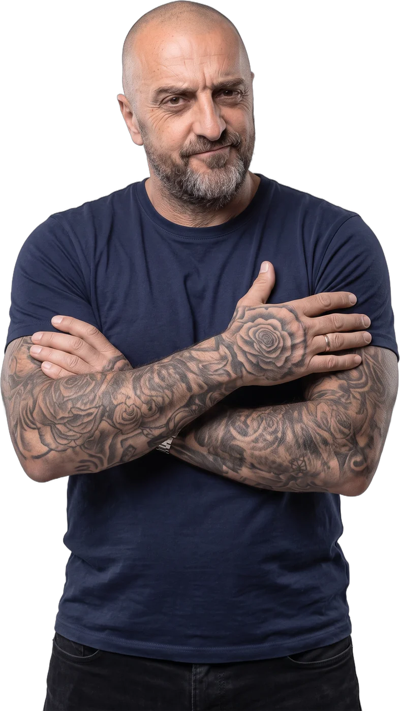 Colin Rooney with his arms folded and a sceptical look