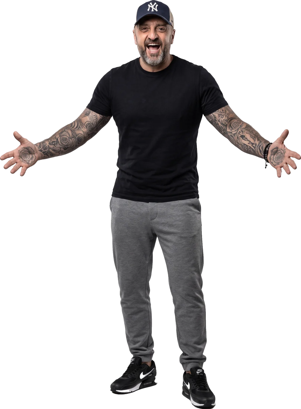 Colin Rooney with his arms open, smiling