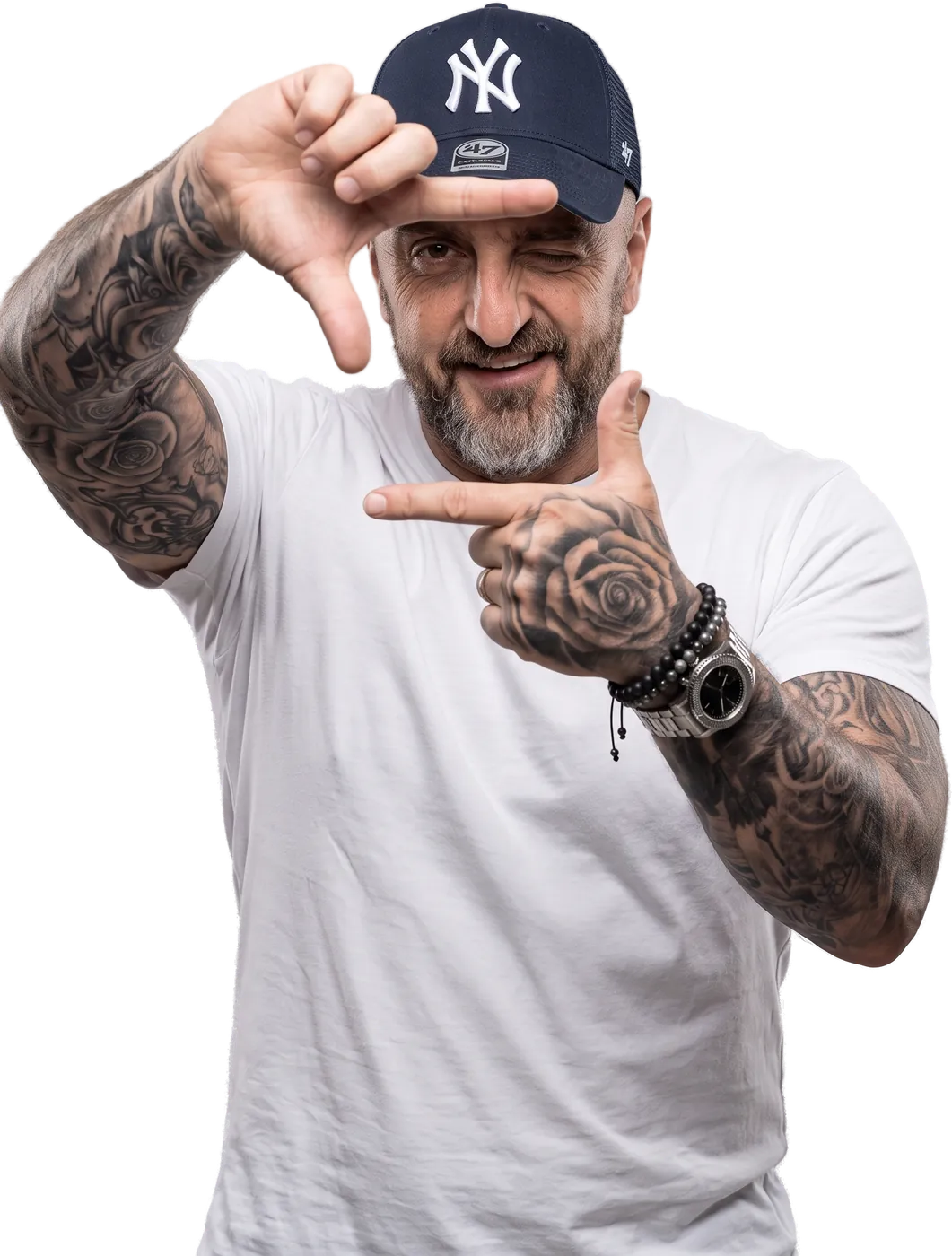 Colin Rooney framing a shot with his hands and winking