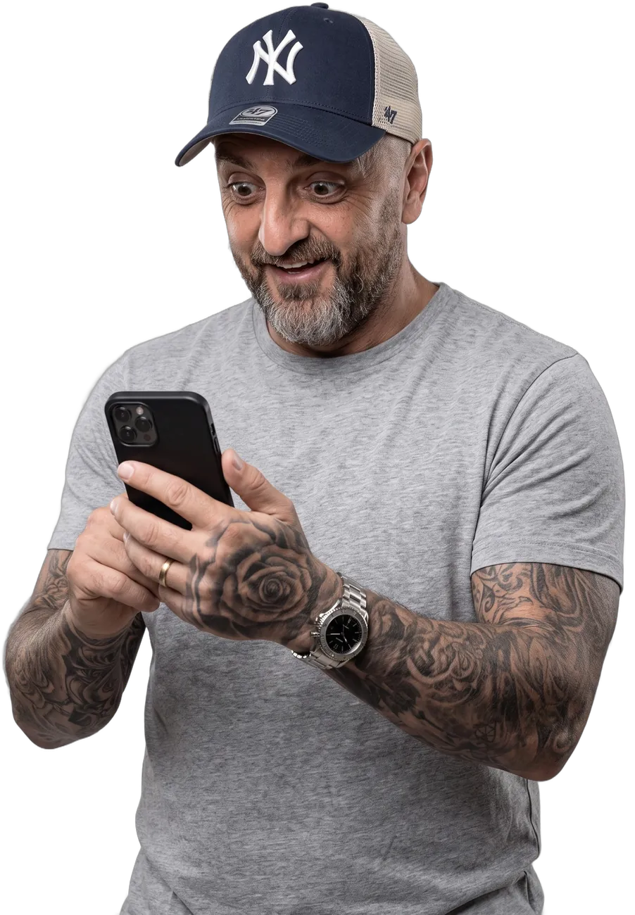 Colin Rooney smiling at his phone