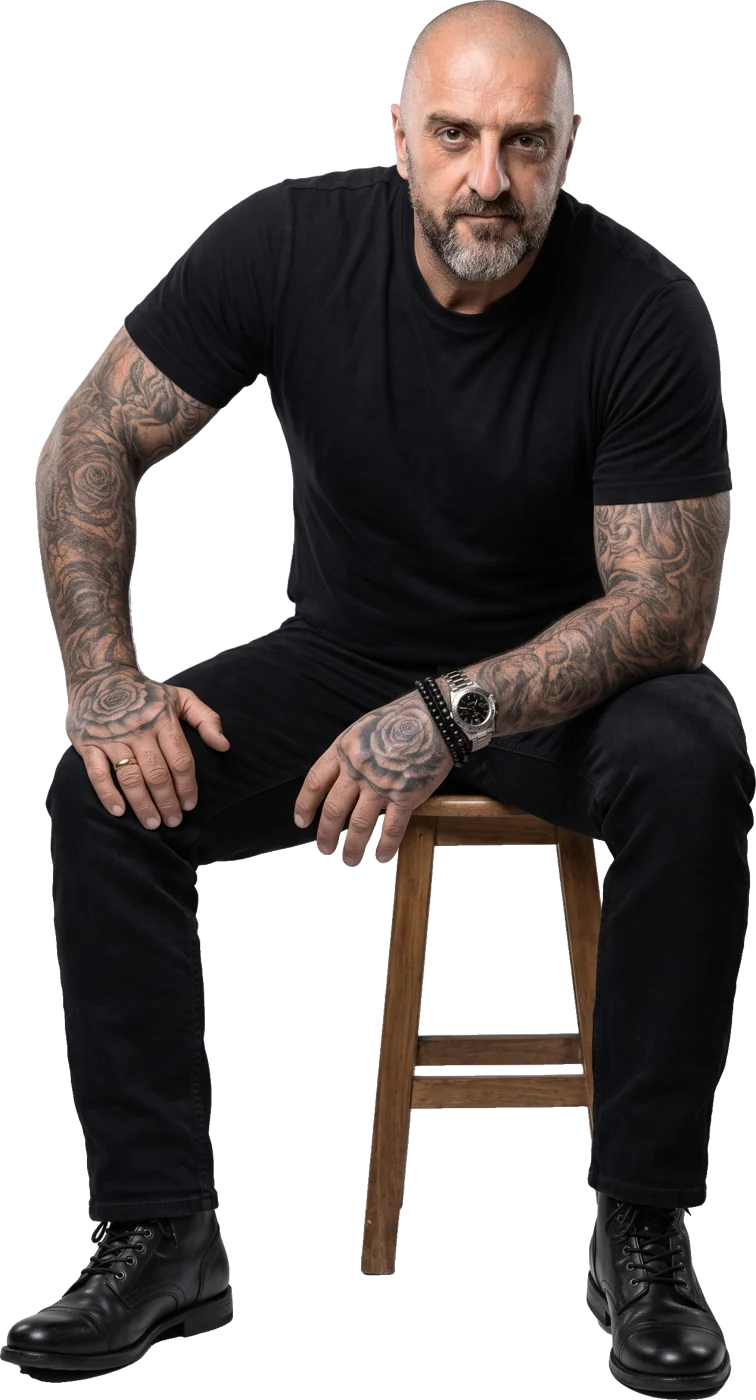 Colin Rooney sitting on a wooden stool