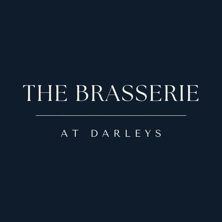 Primary logo for The Brasserie at Darleys, Derby in scallop white on navy, designed by Wonder Works